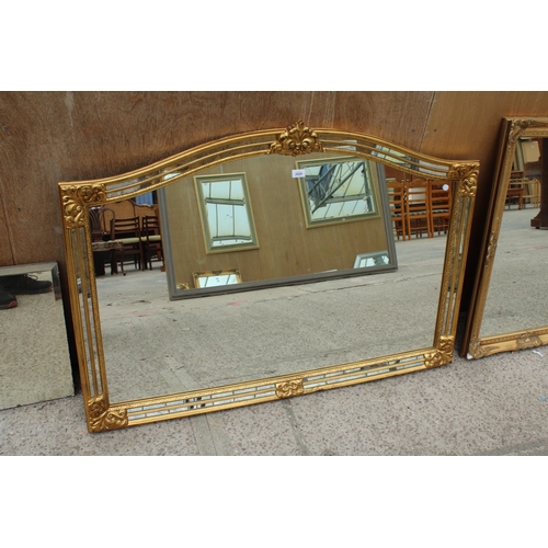 2826 - A GILT EFFECT OVERMANTEL MIRROR WITH DOUBLED MIRRORED EDGE AND FOLIATE DECORATION