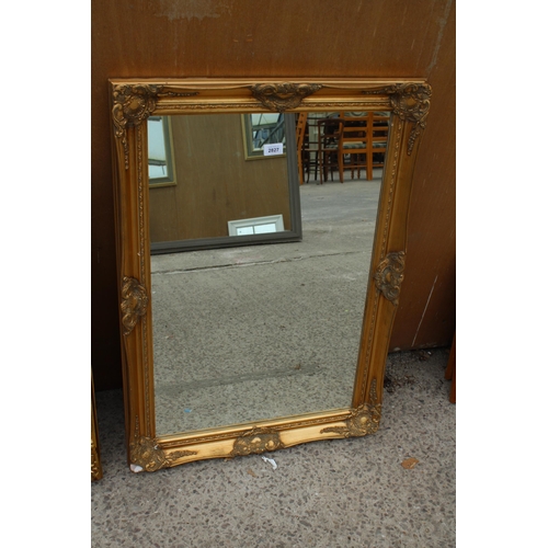 2827 - A GILT FRAMED WALL MIRROR, 35