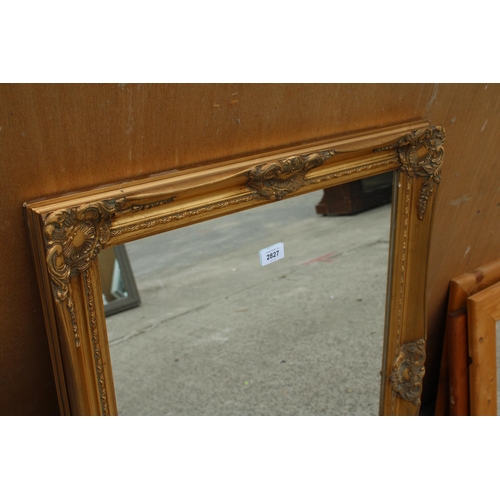 2827 - A GILT FRAMED WALL MIRROR, 35