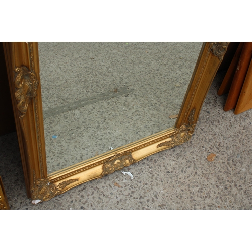 2827 - A GILT FRAMED WALL MIRROR, 35