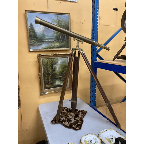 60 - A VINTAGE BRASS TELESCOPE ON A WOOD AND BRASS TRIPOD