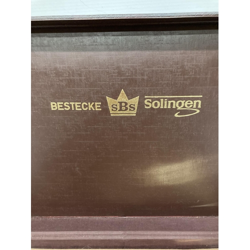 62 - A CASED SET OF BESTECKE (SBS) 24 CARAT GOLD PLATED HARTVERGOLDET SOLINGEN CUTLERY IN A BRIEFCASE