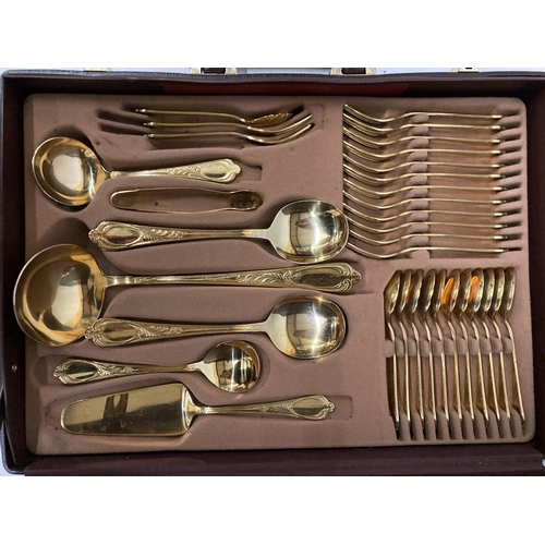 62 - A CASED SET OF BESTECKE (SBS) 24 CARAT GOLD PLATED HARTVERGOLDET SOLINGEN CUTLERY IN A BRIEFCASE