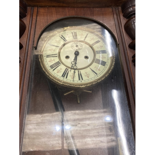 80 - A LONG CASE WALL CLOCK WITH PENDULUM AND WEIGHTS IN MAHOGANY CASING