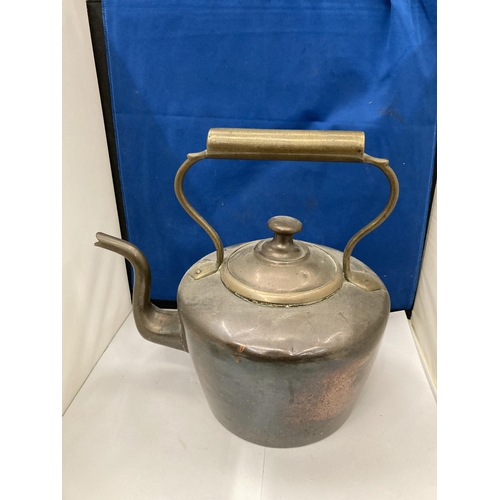 92 - A VINTAGE BRASS AND COPPER KETTLE