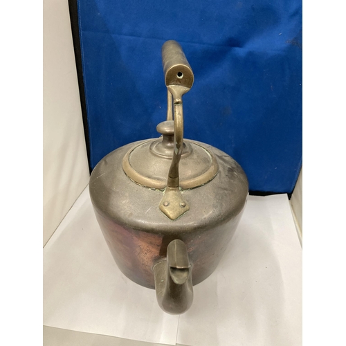 92 - A VINTAGE BRASS AND COPPER KETTLE