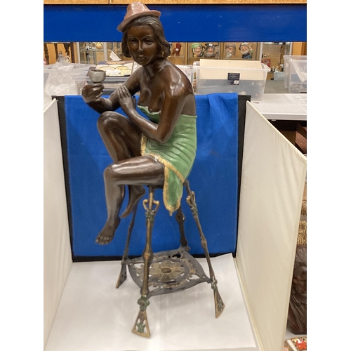 94 - A BRONZE ART DECO STYLE FIGURE OF A SEATED FLAPPER GIRL