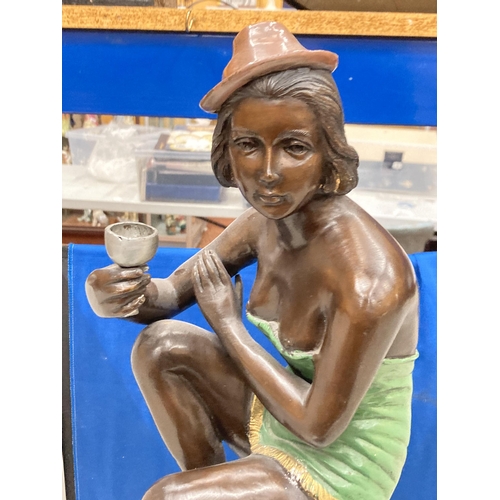 94 - A BRONZE ART DECO STYLE FIGURE OF A SEATED FLAPPER GIRL