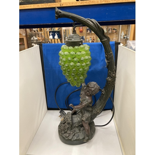 95 - A CAST RESIN FIGURAL TABLE LAMP WITH HANGING GRAPE DECORATION (A/F)