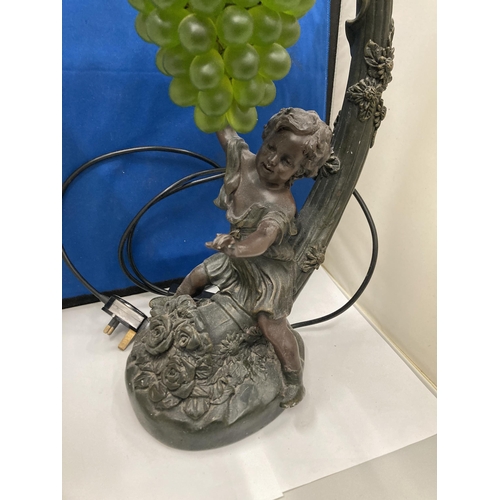 95 - A CAST RESIN FIGURAL TABLE LAMP WITH HANGING GRAPE DECORATION (A/F)