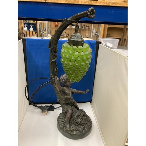 95 - A CAST RESIN FIGURAL TABLE LAMP WITH HANGING GRAPE DECORATION (A/F)