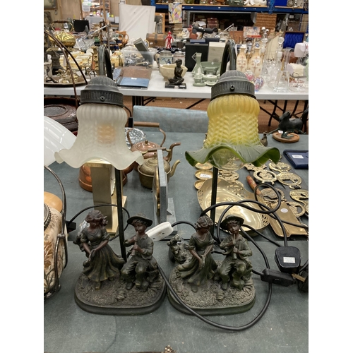 96 - TWO FIGURAL LAMPS DEPICTING A BOY AND GIRL PLAYING INSTRUMENTS WITH TIFFANY STYLE SHADES