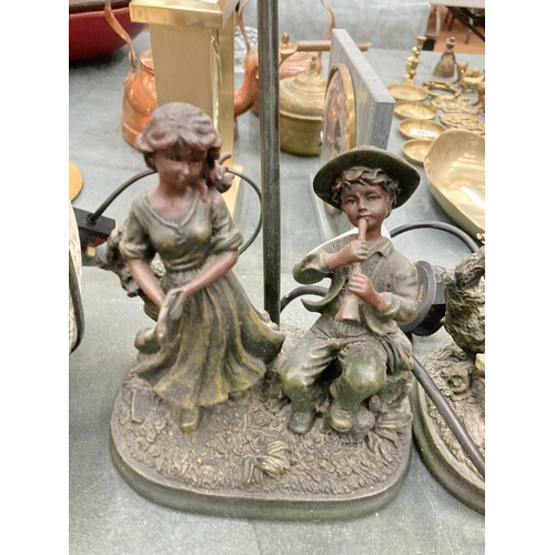 96 - TWO FIGURAL LAMPS DEPICTING A BOY AND GIRL PLAYING INSTRUMENTS WITH TIFFANY STYLE SHADES