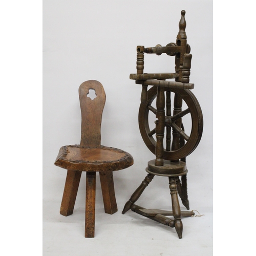 63 - A VINTAGE WOODEN SPINNING WHEEL AND CHAIR