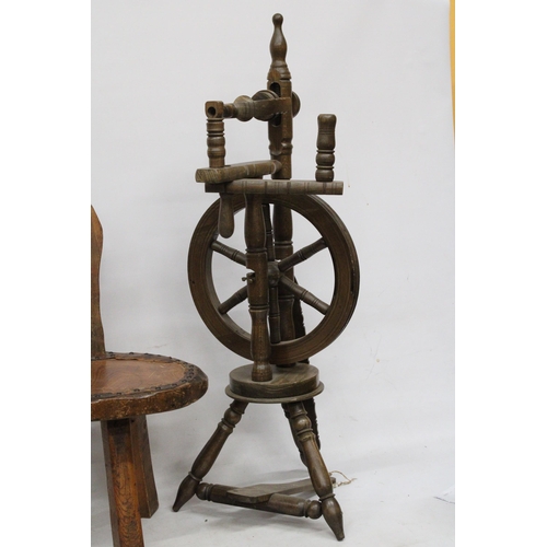 63 - A VINTAGE WOODEN SPINNING WHEEL AND CHAIR