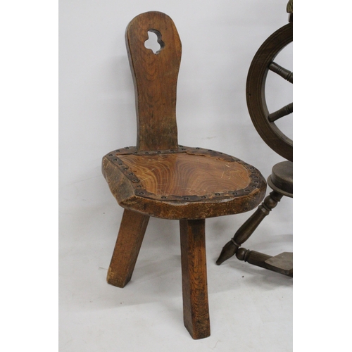 63 - A VINTAGE WOODEN SPINNING WHEEL AND CHAIR