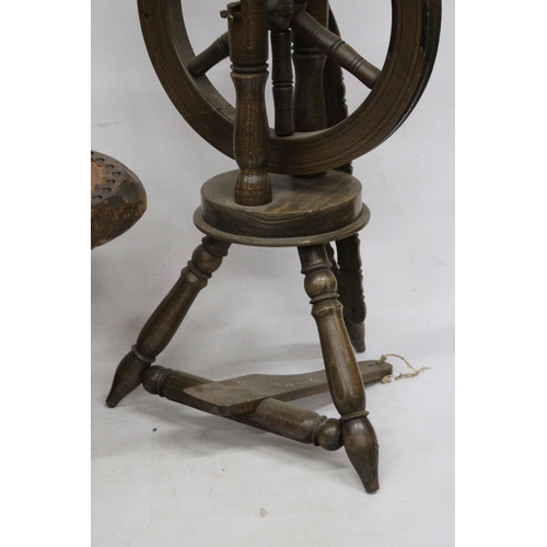 63 - A VINTAGE WOODEN SPINNING WHEEL AND CHAIR