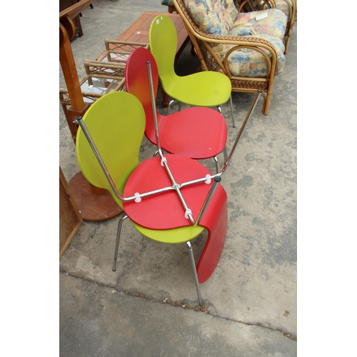 2847 - FOUR COLOURED PLYWOOD KEELER STYLE STACKING CHAIRS, TWO RED AND TWO LIME GREEN