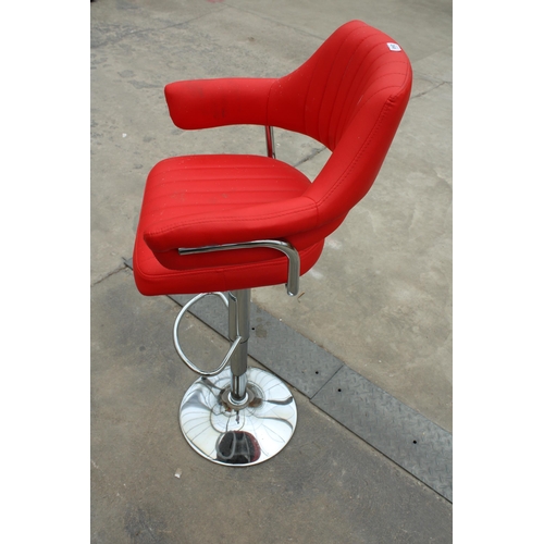 2848 - A PUMP STOOL ON POLISHED CHROME BASE WITH BRIGHT RED FAUX LEATHER SEAT AND ARMS