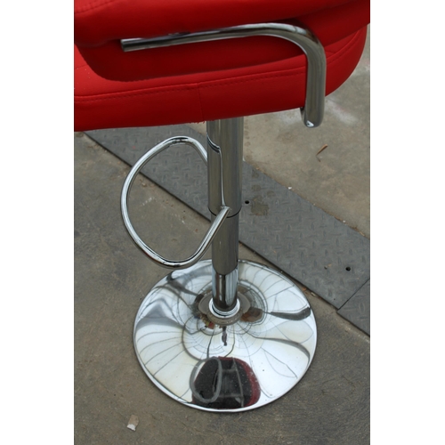 2848 - A PUMP STOOL ON POLISHED CHROME BASE WITH BRIGHT RED FAUX LEATHER SEAT AND ARMS