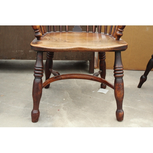 2850 - A 19TH CENTURY ELM HIGH BACK WINDSOR CHAIR WITH PIERCED SPLAT BACK AND CRINOLINE BOW