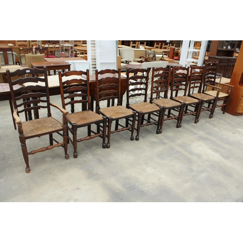 2858 - EIGHT ELM LANCASHIRE STYLE LADDER BACK DINING CHAIRS WITH RUSH SEATS, TWO BEING CARVERS