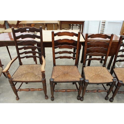 2858 - EIGHT ELM LANCASHIRE STYLE LADDER BACK DINING CHAIRS WITH RUSH SEATS, TWO BEING CARVERS