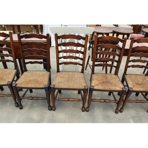 2858 - EIGHT ELM LANCASHIRE STYLE LADDER BACK DINING CHAIRS WITH RUSH SEATS, TWO BEING CARVERS