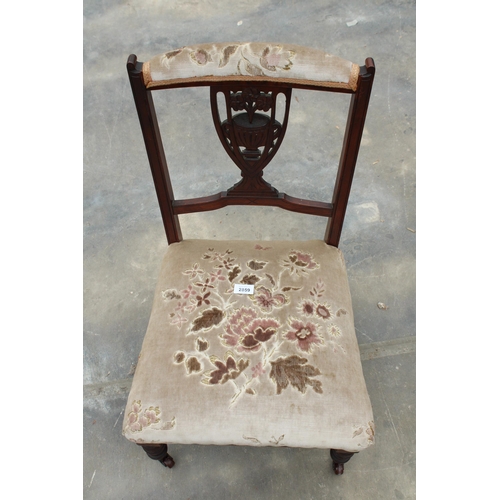 2859 - A LATE VICTORIAN LOW NURSING CHAIR