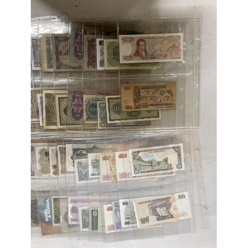 493 - AN ALBUM CONTAINING WORLD BANK NOTES TO INCLUDE LIBYA, RUSSIAN OLD BANK NOTES, SERBIA, KOREA, SUDAN,... 