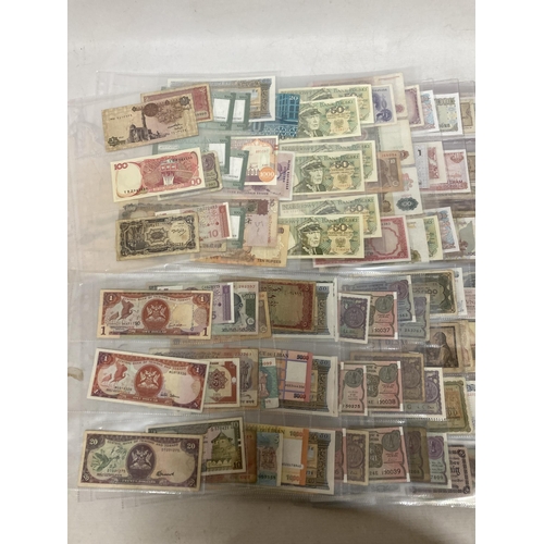 495 - AN ALBUM CONTAINING WORLD BANK NOTES TO INCLUDE CENTRAL BANK OF TRINIDAD AND TOBAGO, NIGERIA, JAPAN,... 