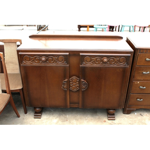 2871 - A MID 20TH CENTURY OAK SIDEBOARD ENCLOSING TWO DRAWERS AND TWO CUPBOARDS, 48