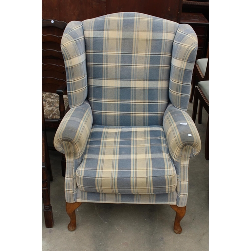 2867 - A BLUE CHECK WINGED FIRESIDE CHAIR WITH FRONT CABRIOLE LEGS