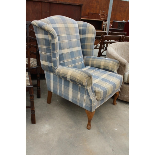 2867 - A BLUE CHECK WINGED FIRESIDE CHAIR WITH FRONT CABRIOLE LEGS