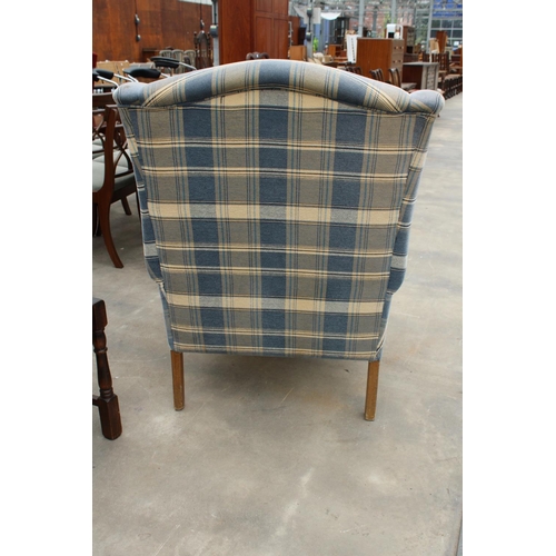 2867 - A BLUE CHECK WINGED FIRESIDE CHAIR WITH FRONT CABRIOLE LEGS