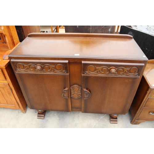 2871 - A MID 20TH CENTURY OAK SIDEBOARD ENCLOSING TWO DRAWERS AND TWO CUPBOARDS, 48