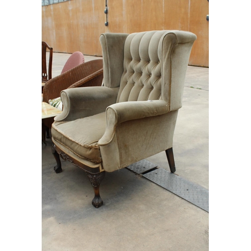 2873 - A HIGH WINGED AND BUTTONED BACK ARMCHAIR ON CARVED MAHOGANY CABRIOLET SUPPORTS