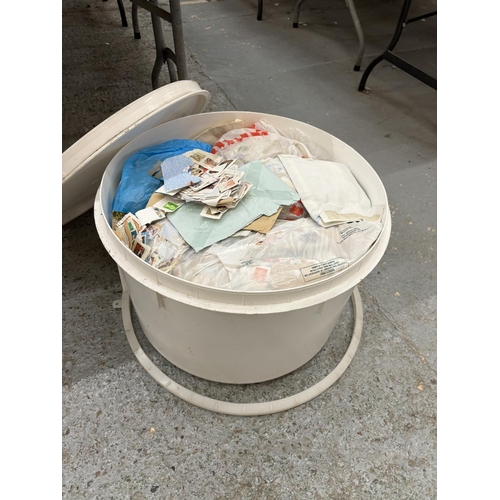 399A - A LARGE TUB OF ASSORTED STAMPS