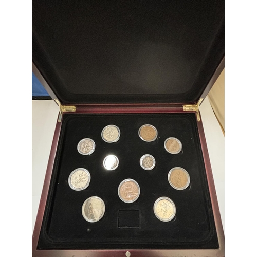 423A - THE COINS OF BRITAIN , LAST CENTURY , HOUSED IN WOODEN BOX .