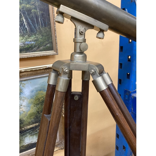 60 - A VINTAGE BRASS TELESCOPE ON A WOOD AND BRASS TRIPOD