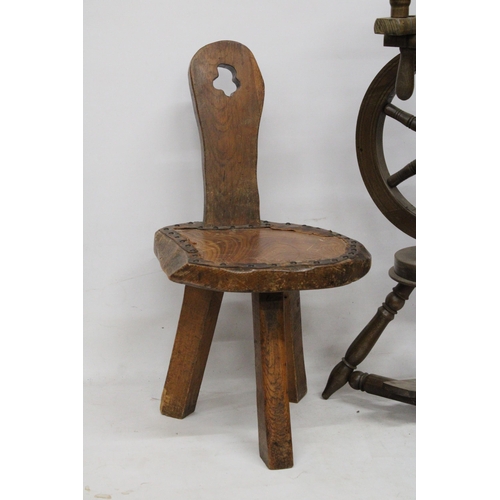 63 - A VINTAGE WOODEN SPINNING WHEEL AND CHAIR