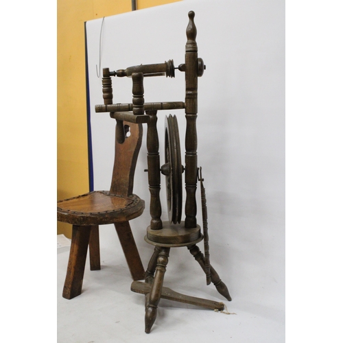 63 - A VINTAGE WOODEN SPINNING WHEEL AND CHAIR