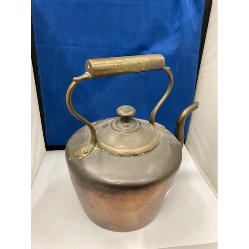 92 - A VINTAGE BRASS AND COPPER KETTLE