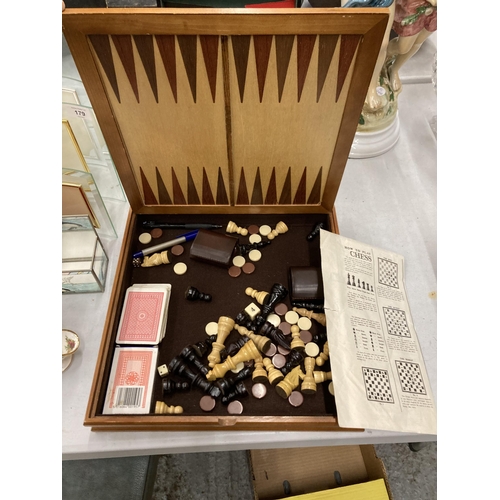 177 - A COLLECTION OF GAMES TO INCLUDE BACKGAMMON, SOLITAIRE PLUS CHESS BOARD AND PIECES