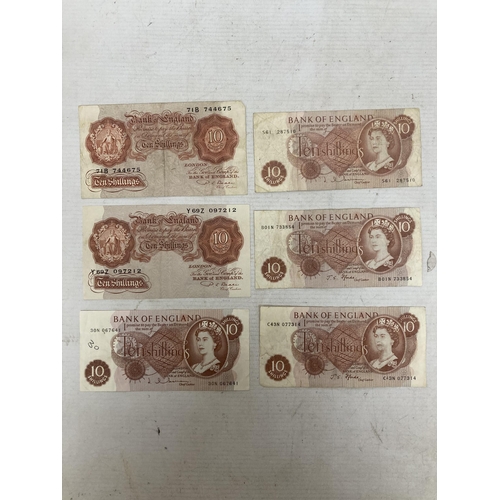 502 - SIX BANK OF ENGLAND TEN SHILLINGS' NOTES FEATURING QUEEN ELIZABETH II TWO SIGNED BY CHIEF CASHIER J.... 