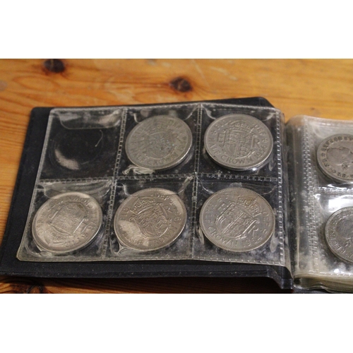 590A - AN ALBUM CONTAINING HALF CROWNS (APPROX 5) 1954 ONWARDS, TWO SHILLINGS (6), 12 ONE SHILLINGS, SIX PE... 