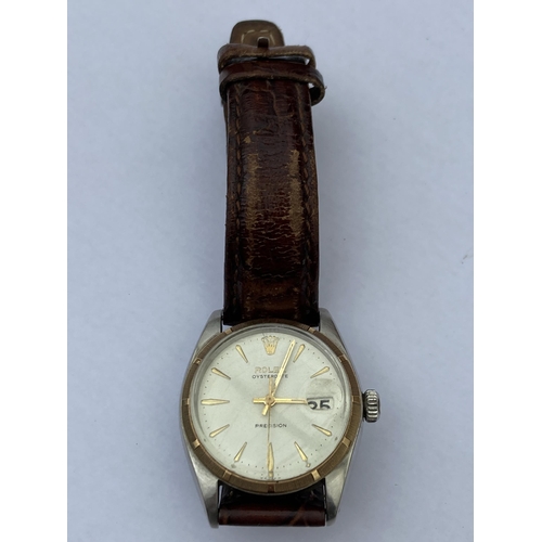 605 - A VINTAGE ROLEX OYSTERDATE PRECISION WRISTWATCH WITH 18CT GOLD BEZEL WITH LEATHER STRAP, NO BOX AND ... 