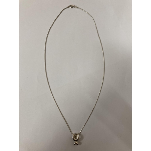 642 - A MARKED 925 SILVER CHAIN WITH A PENDANT, LENGTH OF CHAIN, 55CM