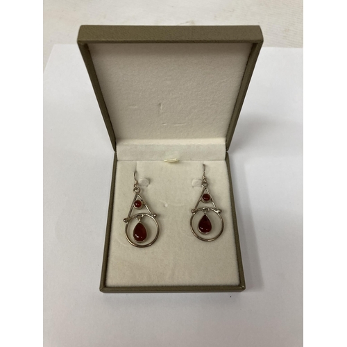 649 - A PAIR OF 925 SILVER, ARTS AND CRAFTS STYLE EARRINGS WITH RED STONES