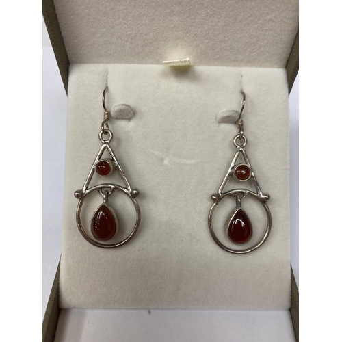 649 - A PAIR OF 925 SILVER, ARTS AND CRAFTS STYLE EARRINGS WITH RED STONES